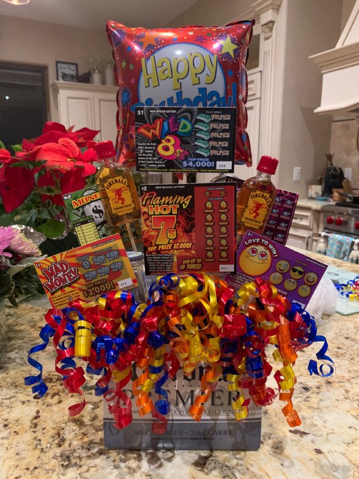 a happy birthday gift basket with candy and candies on the counter in a kitchen