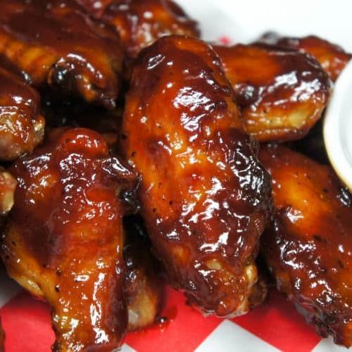 the chicken wings are covered in barbecue sauce