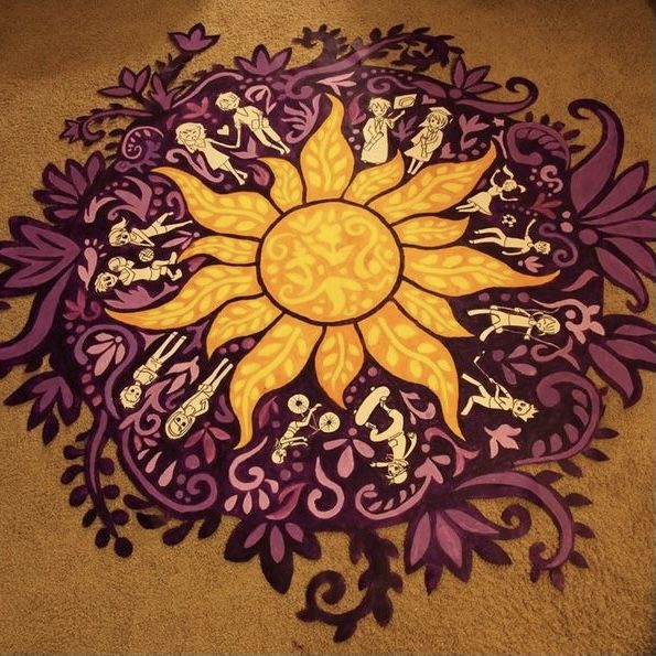 a painting on the ground that looks like a sunflower