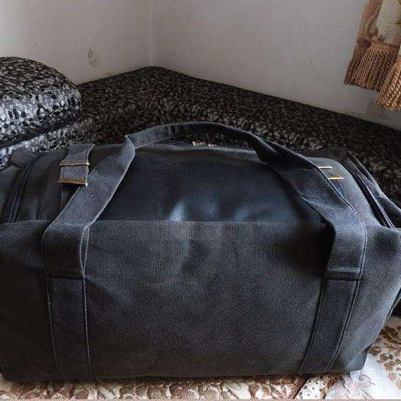 Our Ridgeson Duffle is made of top quality high density canvas, ensuring it won’t rip or tear when you full it. You will be surprised at this travel bag’s size. The large main compartment is perfect for clothes and traveling necessities, suitable for 3-4 days weekender or business trip, and both sizes can be used as a carry-on flight bag. The handles on the large size will fit over your shoulders to be used as a backpack and the medium size comes with an adjustable and detachable strap for ease Black Rectangular Canvas Duffle Bag, Black Travel Bag With Canvas Lining For Daily Use, Practical Black Travel Bag For Weekend Trips, Black Canvas Weekender Bag With Large Capacity, Black Canvas Bag For Weekend Trips, Black Rectangular Canvas Travel Bag, Black Canvas Bag With Luggage Sleeve For Daily Use, Black Duffle Bag With Canvas Lining For Everyday Use, Black Canvas Travel Bag With Zipper Closure