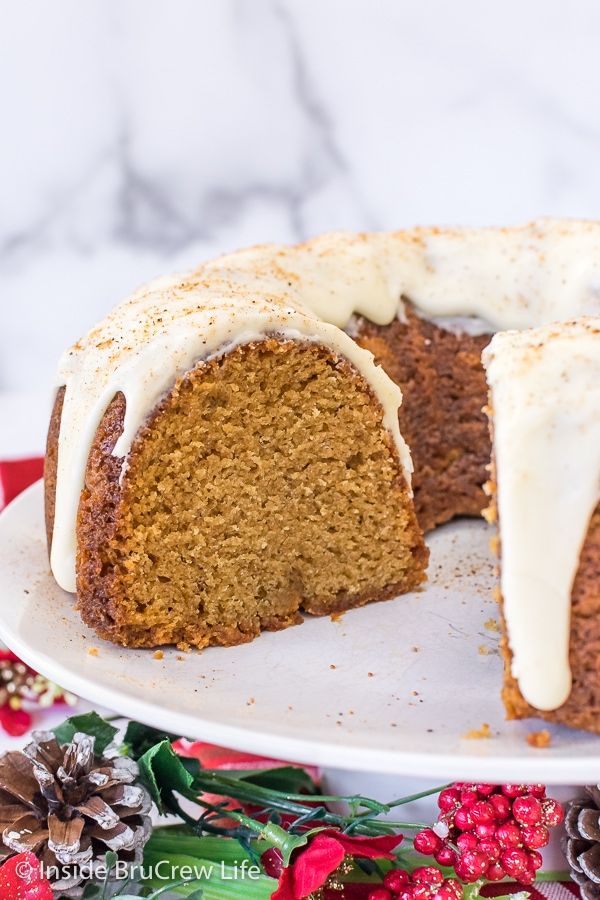 a bundt cake with white frosting on a plate