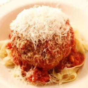 a white plate topped with spaghetti and meatballs