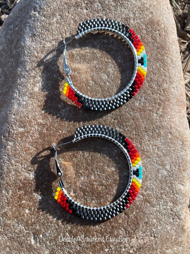 Gunmetal Gray With Native Colors Beaded 1 1/4 Inch Hoop - Etsy Metal Hoop Beaded Earrings, Beaded Metal Small Hoop Earrings, Small Beaded Metal Hoop Earrings, Metal Hoop Beaded Earrings For Pierced Ears, Nickel-free Small Hoop Metal Beaded Earrings, Small Beaded Hoop Earrings In Metal, Handmade Multicolor Metal Hoop Earrings, Small Hoop Metal Jewelry With Dangling Beads, Small Hoop Metal Earrings With Dangling Beads