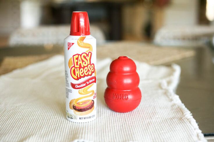 a bottle of easy cheetos next to a red pepper shaker