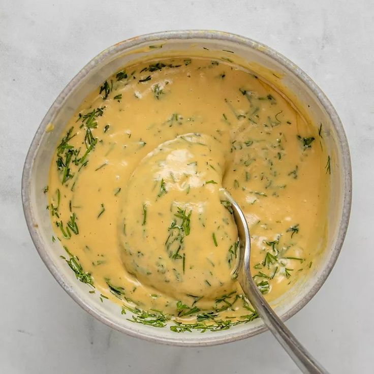 a bowl filled with soup and a spoon