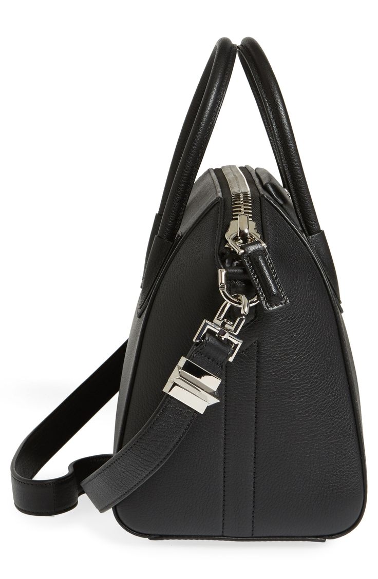 Beloved by street-style mavens the world over, Givenchy's Antigona satchel is updated in richly dyed leather, imparting subtle texture to the structured style. A chic, compact size, rolled top handles and an optional shoulder strap add versatility to the fashionable bag. Top zip closure Top carry handles; removable shoulder strap Interior wall, zip and smartphone pockets Protective feet Leather Made in Italy Designer Handbags Designer Leather Briefcase With Zipper Closure, Black Leather Briefcase With Silver-tone Hardware, Designer Textured Leather Satchel For Formal Use, Leather Briefcase With Silver-tone Hardware For Formal Use, Formal Leather Briefcase With Silver-tone Hardware, Modern Satchel With Palladium Hardware, Modern Satchel With Silver-tone Hardware, Modern Satchel In Textured Leather, Leather Briefcase With Silver-tone Hardware Satchel