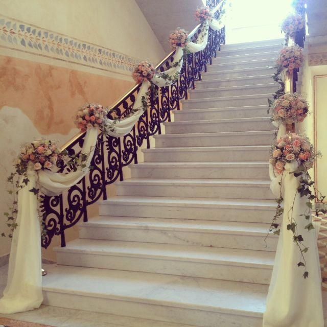 the stairs are decorated with flowers and ribbons