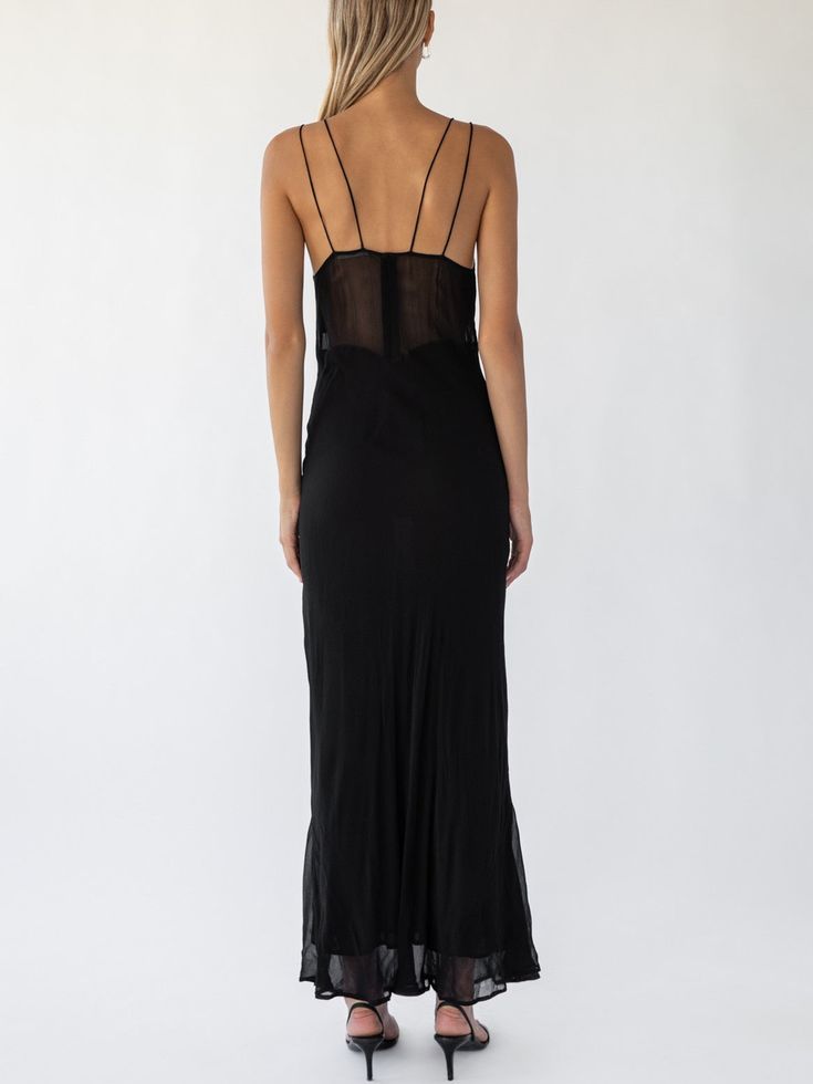 Stunning classic black maxi dress with sheer empire panel and double strap design. Cut on the bias and slightly sheer fabric. Measurements: 0 (XS): Bust 32.5"-33.5" Waist 24"-25" Hips 34"-35" 1 (S): Bust 34"-35" Waist 25"-26" Hips 35"-36" 2 (M): Bust 35"-36" Waist 26"-27" Hips 36"-37" 3 (L): Bust 36"-37" Waist 27"-28" Hips 37"-38" 100% Viscose, dry clean only Elegant Black Sheer Slip Dress, Sheer Fitted Slip Dress For Date Night, Elegant Sheer Slip Dress For Date Night, Fitted Sheer Slip Dress For Evening, Sheer Back Sleeveless Slip Dress For Evening, Fitted Slip Dress With Sheer Back For Night Out, Sheer Slip Dress For Spring Evening, Black Bias Cut Maxi Slip Dress, Chic Sheer Evening Slip Dress