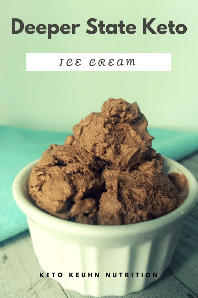 a bowl filled with ice cream sitting on top of a table