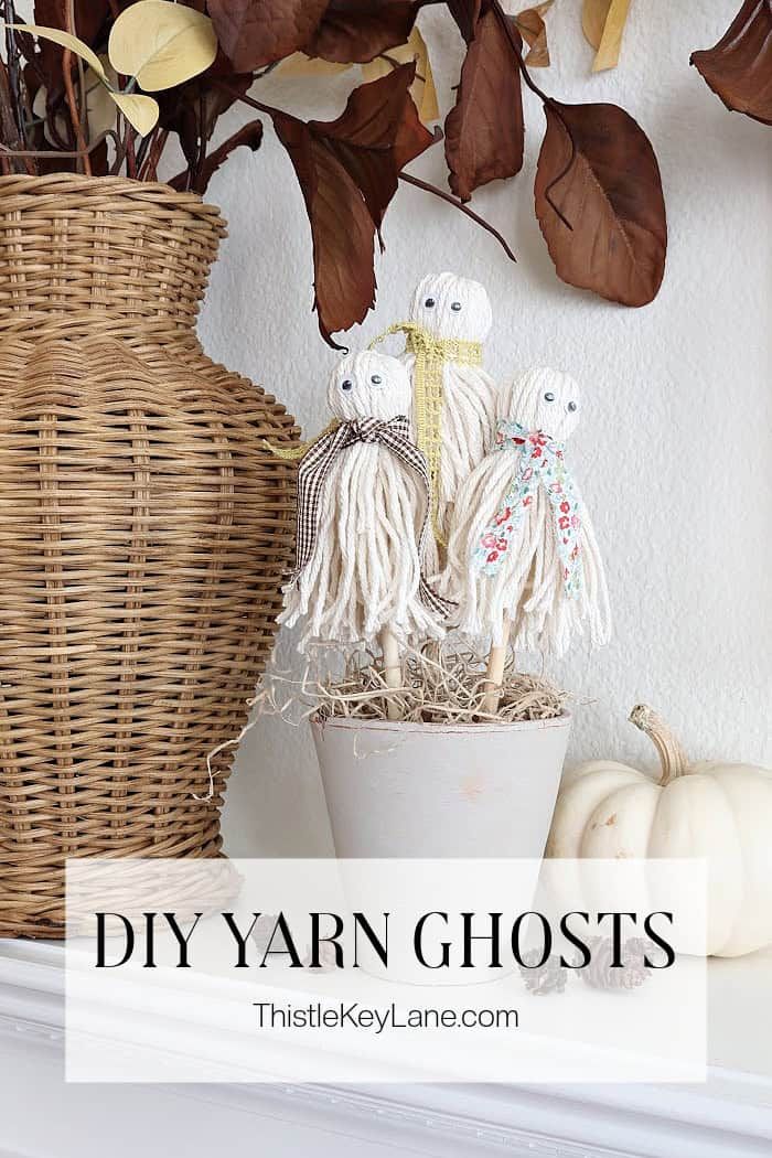 some fake ghost figurines sitting on top of a shelf next to a basket