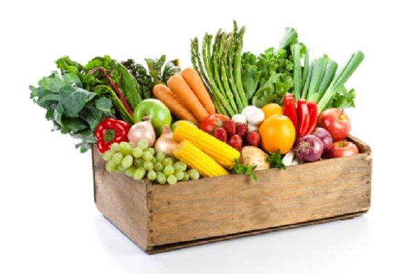 a wooden box filled with lots of different types of vegetables