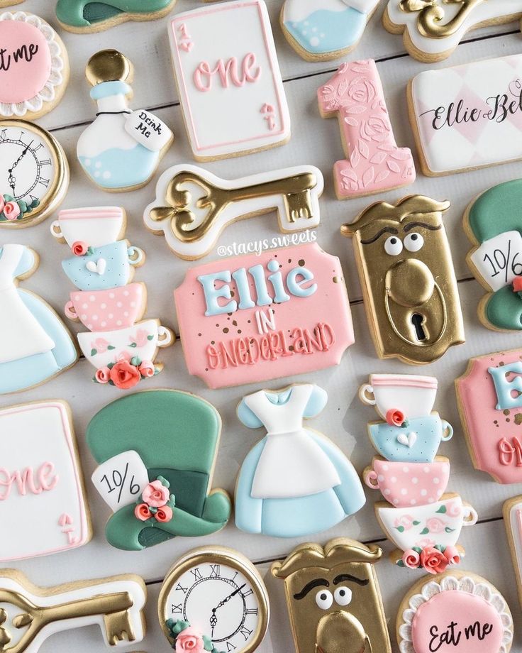 decorated cookies are arranged on a table for a baby's first birthday party or special occasion