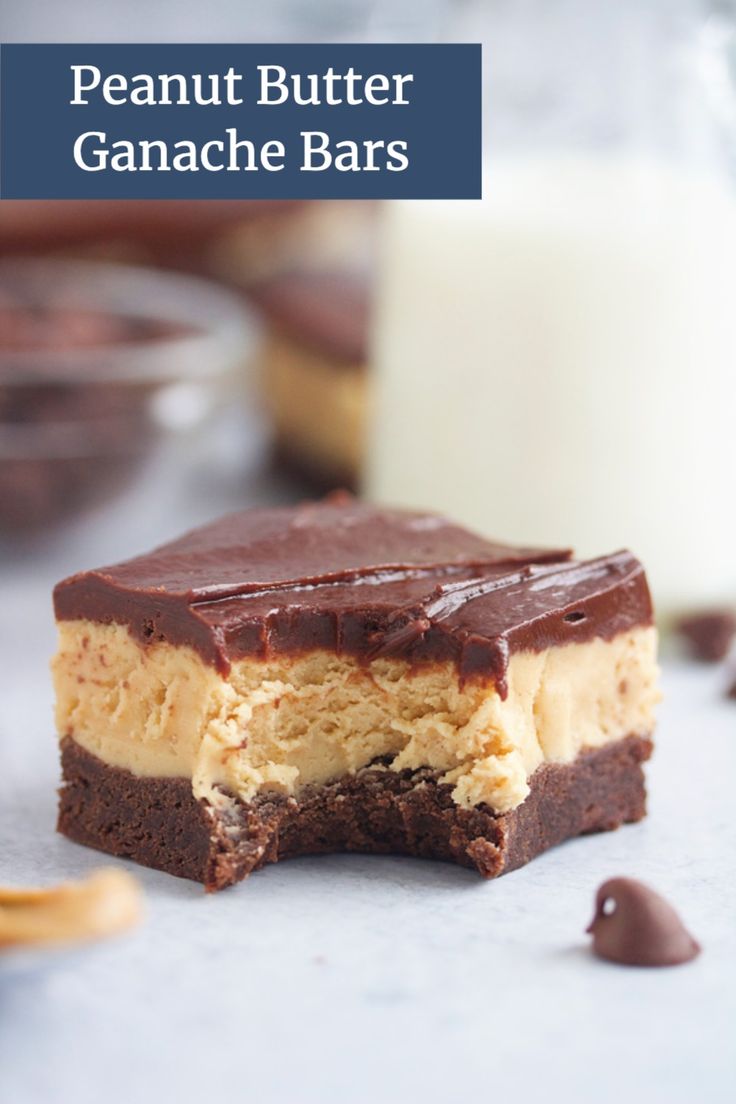 a piece of cake sitting on top of a table next to a glass of milk