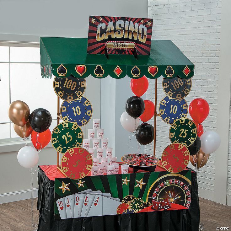 a casino themed party with balloons and streamers