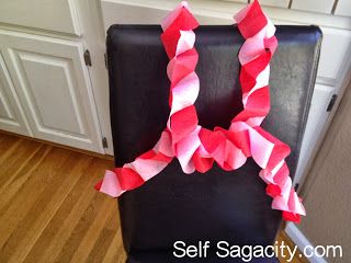 a black chair with pink and white strips on it