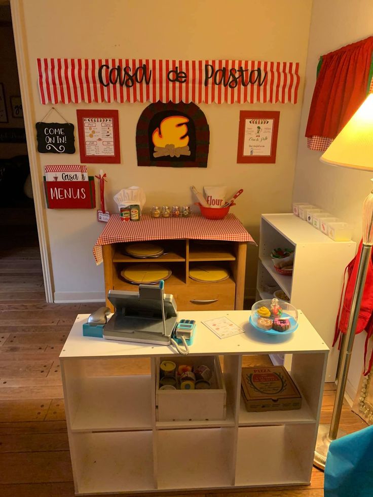 a toy kitchen and play area in a child's room