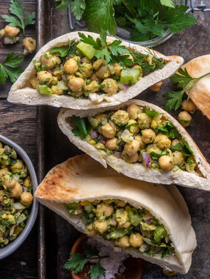 three pita sandwiches with chickpeas and cilantro