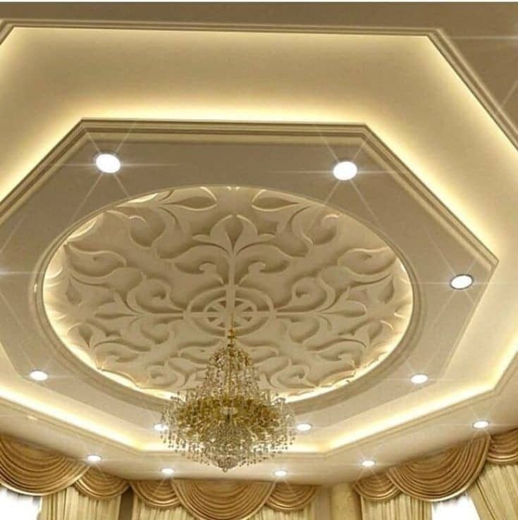 the ceiling in this room is decorated with chandelier and curtains