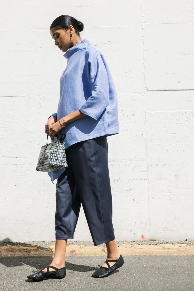 Dusan Asymmetric T-Neck in Light Blue Made in Italy Blue Asymmetrical Blouse, Blue Asymmetrical Blouse For Spring, Blue Asymmetrical Hem Top For Summer, Casual Blue Asymmetrical Top, Blue Asymmetrical Hem Summer Top, Modern Blue Tops For Summer, Chic Blue Asymmetrical Blouse, Asymmetrical Blue Blouse For Workwear, Asymmetrical Blue Blouse For Work