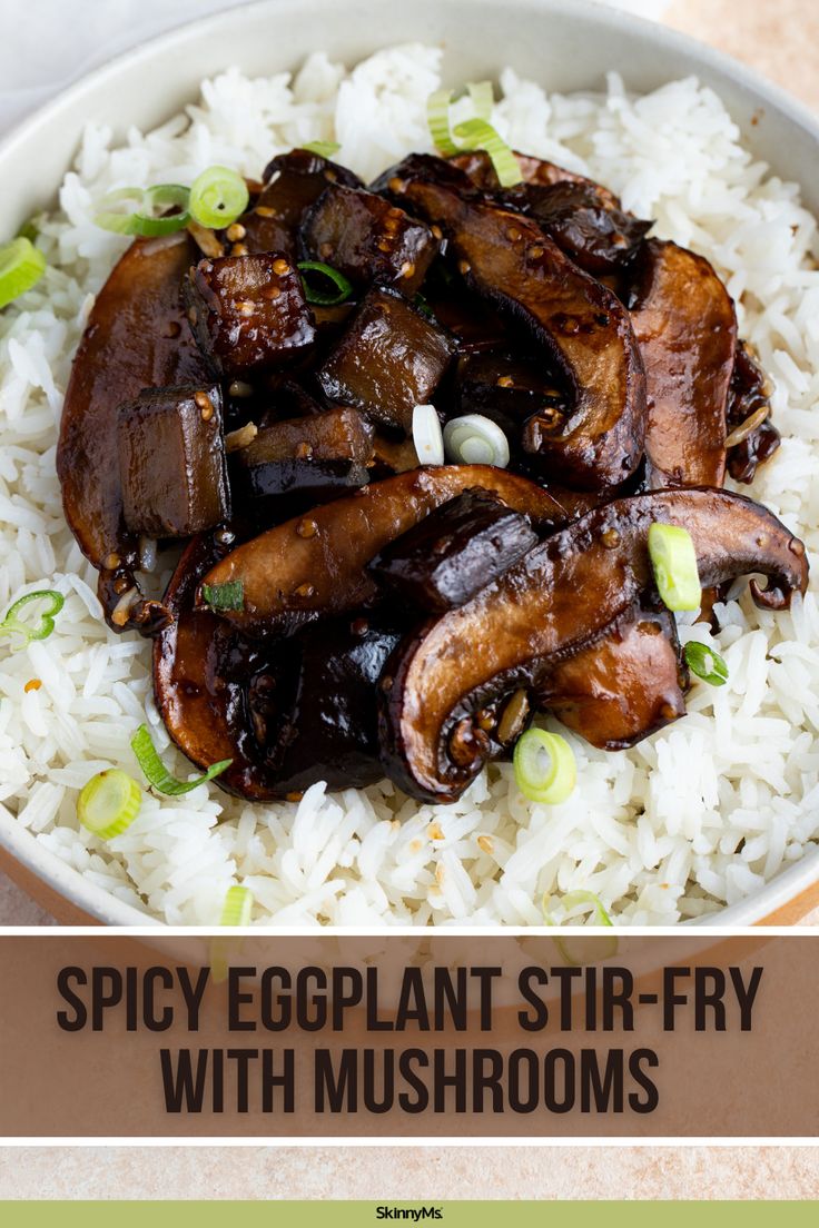 a bowl filled with rice and mushrooms on top of a wooden table next to the words spicy eggplant stir - fry with mushrooms