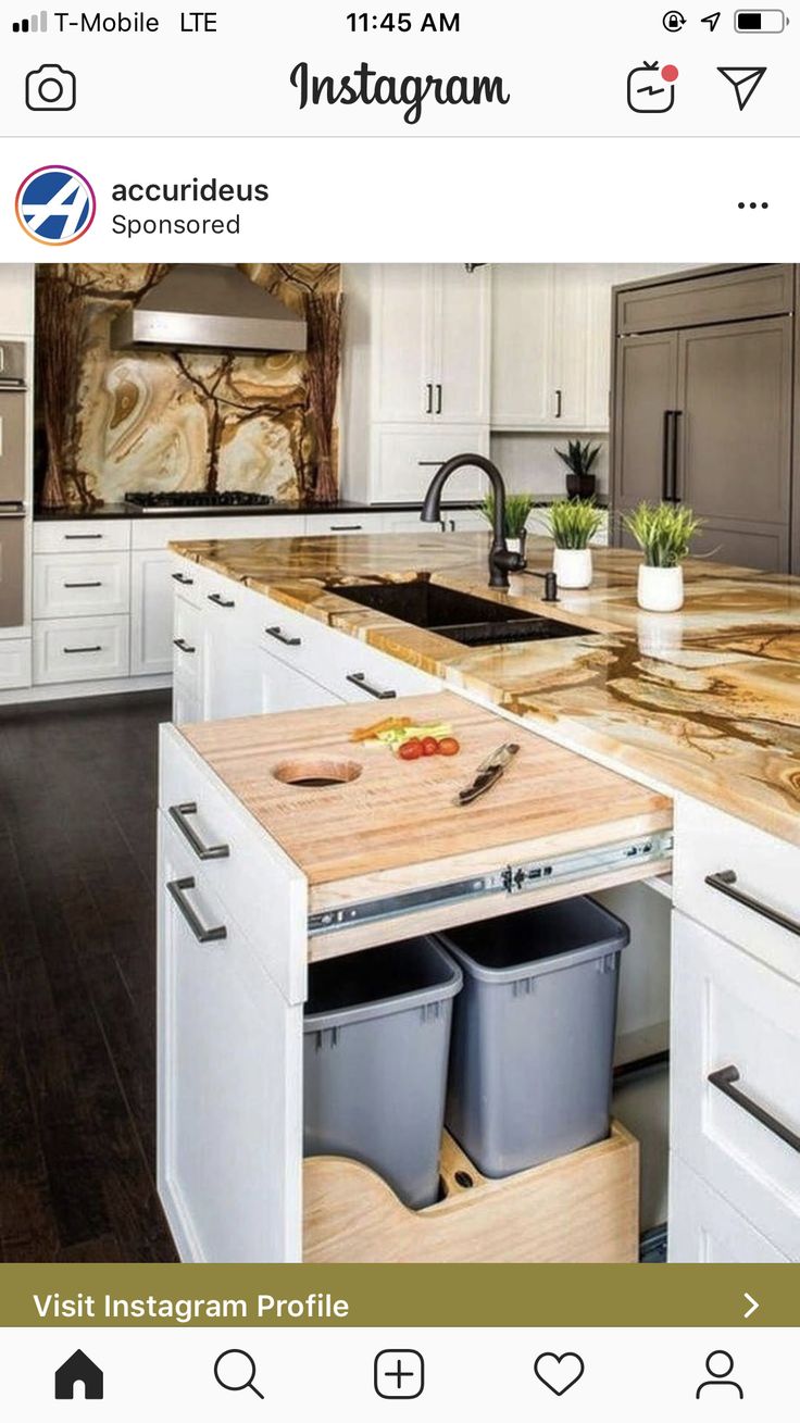 the instagram page shows an image of a kitchen with white cabinets and wood counter tops