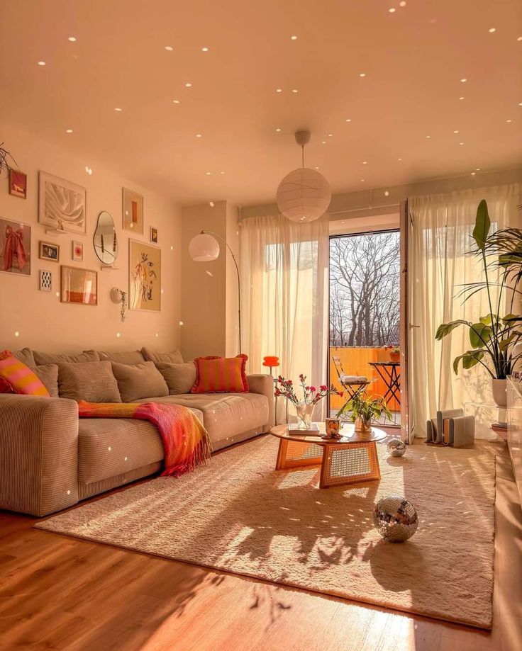 a living room filled with furniture and lots of windows