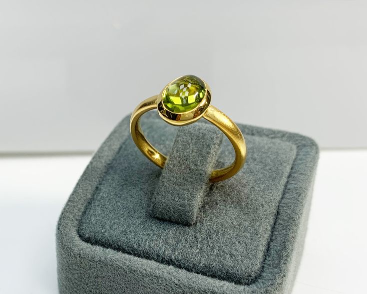 Natural Peridot Ring * Dainty Cabachon Ring * Genuine Peridot & 14K Solid Gold * Best Gift for Her/Him * Handmade Ring ◎ Details ◎ ○ Gemstone Details .Natural PERIDOT Oval Cut 9X7 mm approx. 2.01 ct ○ Gold Details 14K Solid Gold Width of Band : 2.50 mm Weight of Ring : approx 3.80 gr Made to Order HANDMADE ITEM ○ Upgrade to Solid 18K Gold, please click the link below: https://www.etsy.com/listing/962826004 For more CABACHON BEZEL rings : http://etsy.me/37fvI60 ○ PERIDOT RINGS : https://etsy. Yellow Gold Cabochon Ring, Yellow Gold Oval Cabochon Gemstones For Anniversary, Gold Cabochon Birthstone Ring Gift, Yellow Gold Emerald Cabochon Ring Gift, Yellow Gold Emerald Ring, Oval Cabochon Gift, Oval Cabochon Emerald Ring In Yellow Gold, Yellow Gold Oval Cabochon Emerald Ring, Gold Oval Gemstones With Bezel Setting, Gold Cabochon Ring With Round Stone