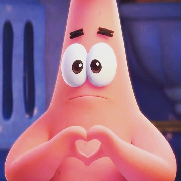 a close up of a cartoon character making a heart shape with his hands and eyes