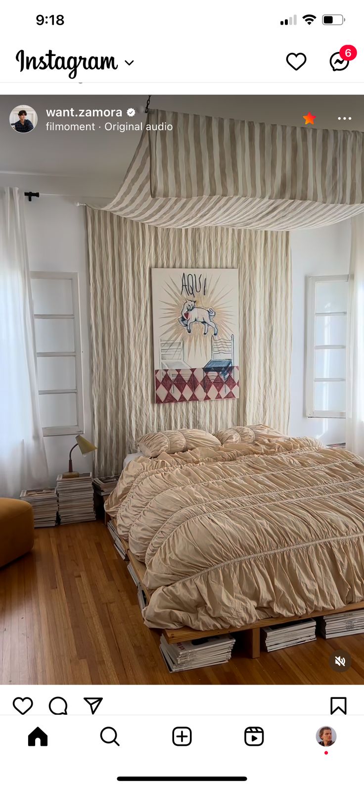 an instagram photo of a bed in a room with white walls and wooden floors