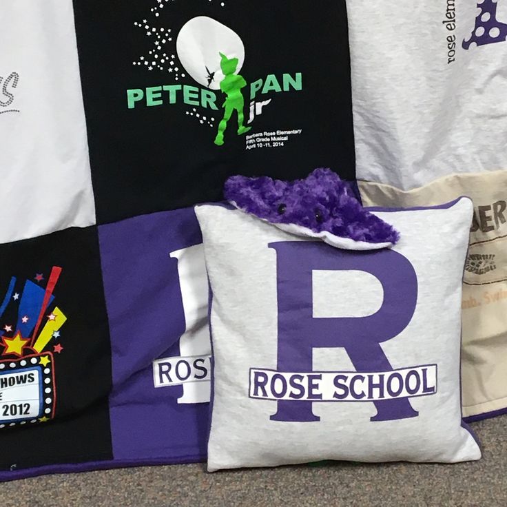 pillows and t - shirts are on display at the rose school's showroom