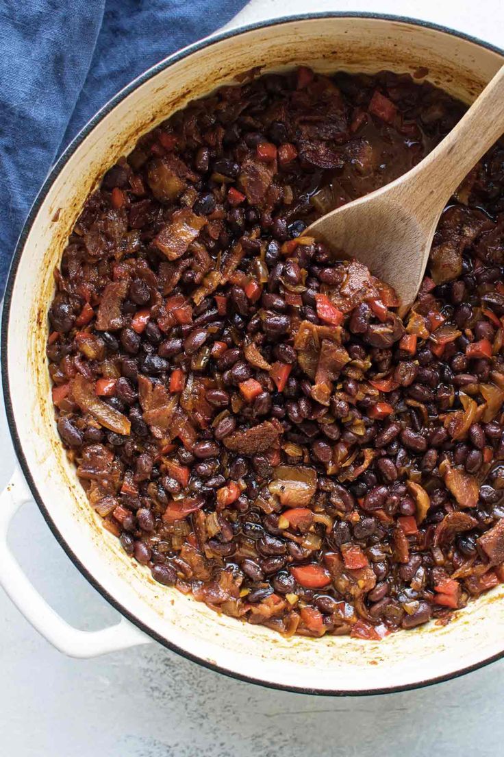 a large pot filled with beans and meat