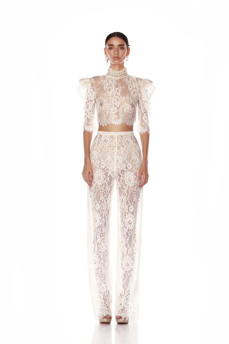 Achieve effortless elegance in our Capri Blanc Lace Pants, designed with a high rise and elastic waist for comfort and style.  High rise, elastic waist Back zipper Full length Unlined After Party Looks, Event Clothes, Sorrows Of Mary, Bridal Pants, Clothes Websites, Wedding Pantsuit, Autumn Accessories, Silver Mini Dress, Silver Gown