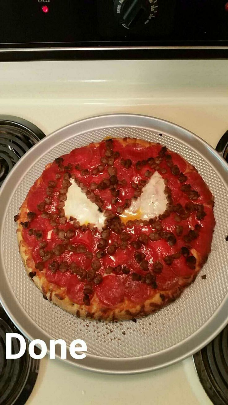 a pizza sitting on top of a pan covered in sauce and cheese with the words don't over it