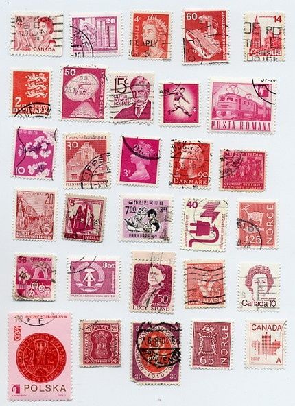 many different colored stamps on a white surface with red and pink inks, including one in the middle