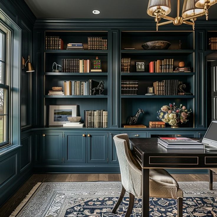 a home office with built in bookshelves and blue walls, along with a rug on the floor