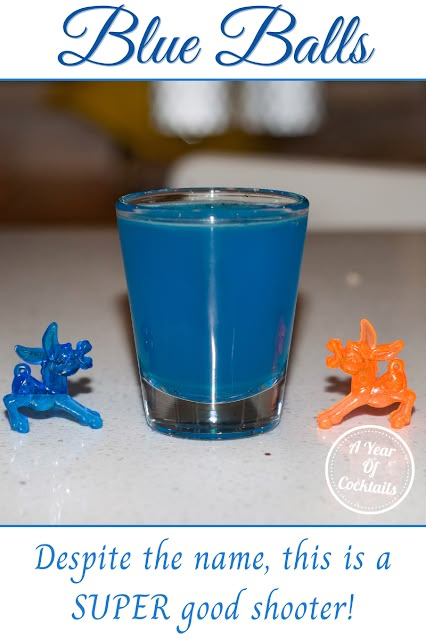 blue balls are sitting next to a shot glass on a table with the caption, despite the name, this is a super good shooter