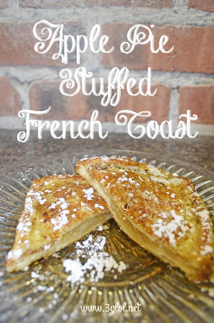 apple pie stuffed french toast on a glass plate with powdered sugar over the top