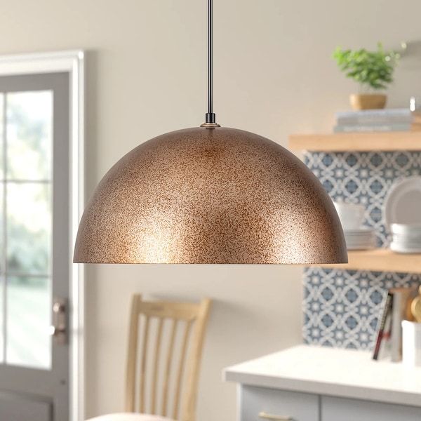 a light hanging from a ceiling in a kitchen