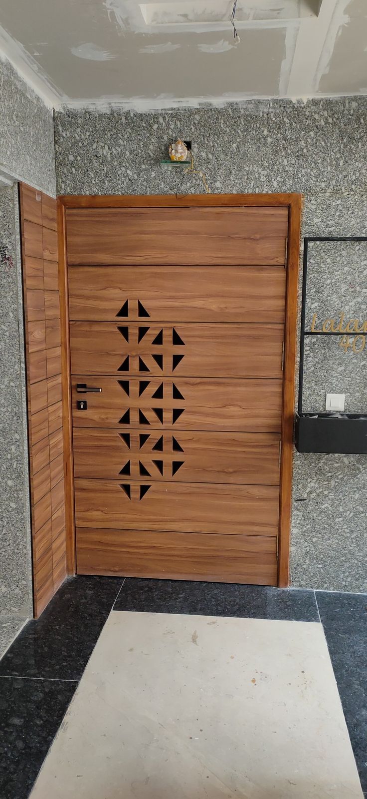 a wooden door with geometric designs on it