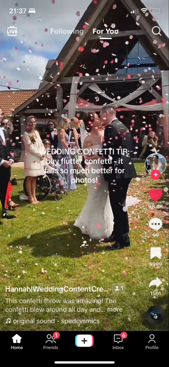 a couple getting married in front of their wedding party with confetti falling from the sky