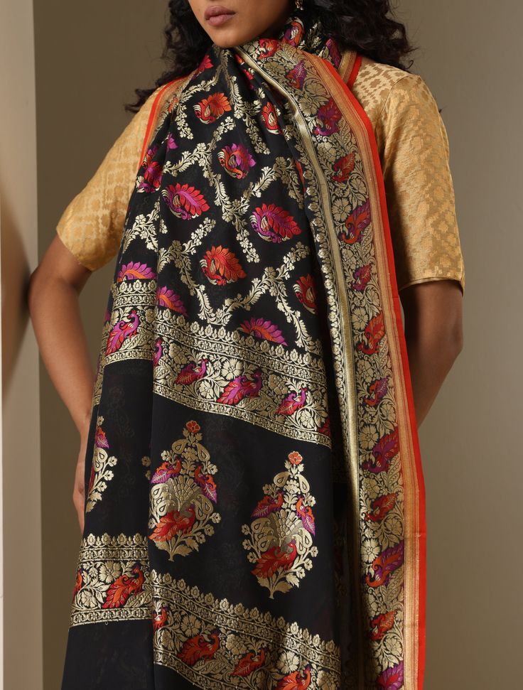 An exclusive Banarasi Handloom saree from Khinkhwab. Add a dash of your favorite color to your ethnic look with this beautiful Banarasi saree from our Birds of Paradise collection. The Saree is made of pure Georgette silk and has the illustrious birds motifs weave. Jaal weave is inherent to Banarasi weaving and this saree is the epitome of the craftsmanship of the renowned weavers of Banaras. Pre-draped Handloom Jamawar Saree, Designer Multicolor Katan Silk Dupatta, Chanderi Pre-draped Saree With Traditional Patterns, Jamawar Pre-draped Saree For Traditional Ceremonies, Pre-draped Jamawar Saree For Festivals, Tussar Silk Shawl With Cutdana For Festivals, Festive Tussar Silk Pashmina Shawl With Self Design, Traditional Drape Shawl For Navratri, Pre-draped Saree With Dupatta For Eid