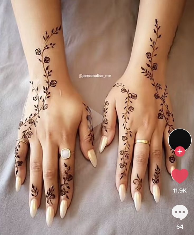 two hands with hendi designs on them