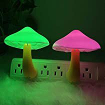 two mushroom shaped lights sitting on top of a power strip