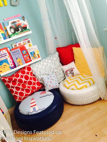 a child's room with bookshelves and toys on the wall, including an inflatable chair