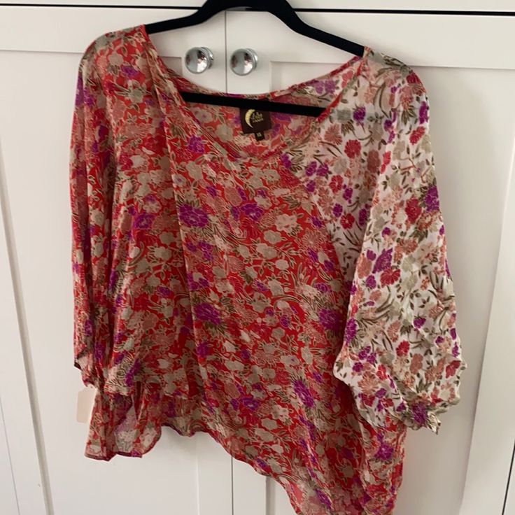 Blu Moon Flowe Top, Zoom In For Detail. Bought At A Sample Sale, Never Worn. Xs But Flowe & Roomy. Shorter In The Front, Longer In The Back. One Tiny Flaw In The Front V Neck Area But I Put A Photo & You Really Cannot See It. It Is A Flowe Drapery Top. Zoom In For Additional Details Of Pattern And Colors. Very Cute. Purple Floral Print Summer Top, Summer Floral Print Purple Blouse, Summer Floral Print Purple Tops, Summer Purple Floral Print Blouse, Summer Purple Floral Print Top, Purple Flowy Beach Top, Flowy Purple Beach Top, Pink Floral Print Festival Blouse, Summer Festival Blouse With Floral Print