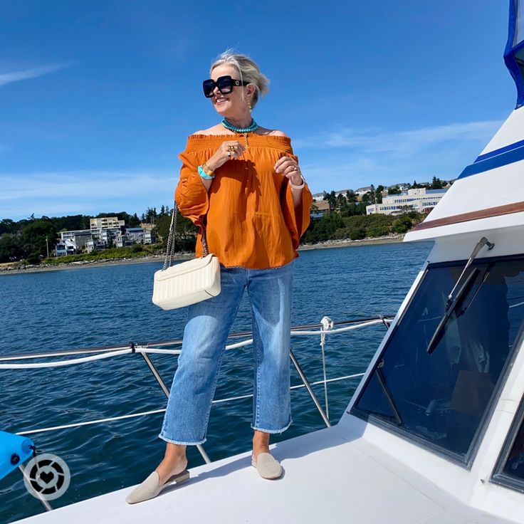 Burnt orange off the shoulder top with straight highrise cropped jeans. Burnt Orange Top, Light Blue Top, Orange Pants, Orange Top, Visit Florida, Blue Pants, Women Helping Women, Burnt Orange, Cropped Jeans