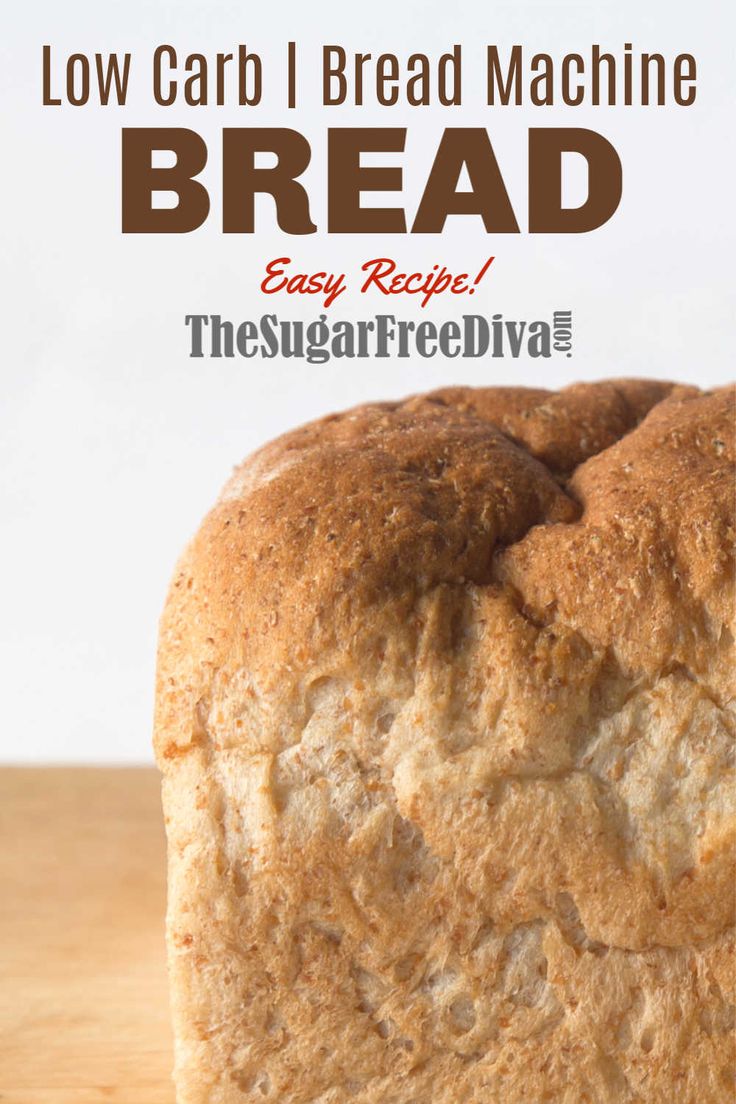 a loaf of bread sitting on top of a cutting board with the words low carb bread machine bread