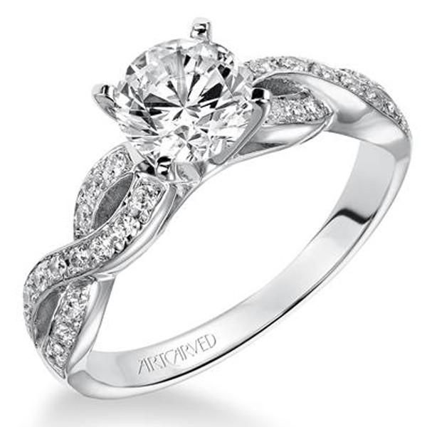 a white gold engagement ring with diamonds on it