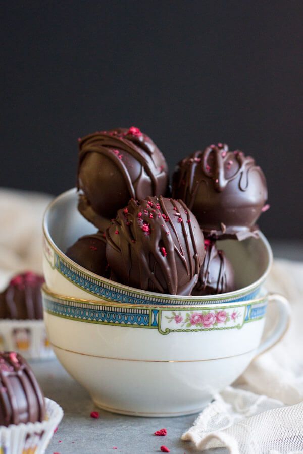 chocolate raspberry truffles in a white bowl