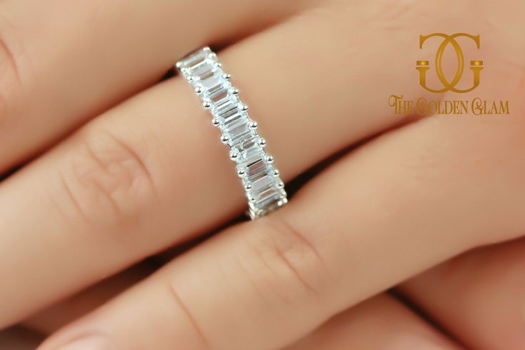 Thank you for visiting our jewelry shop! Item Details: * Brand Name: The Golden Glam * Total Carat Weight (CTW) : Appx 3 Carats * Number of Stones: 30 * Stone Dimensions: 1 pc 3x2 mm * Stone Shape: Baguette Cut * Diamond Type: Simulated Diamond * Stone Color: D color * Stone Clarity: VVS1 * Metal: 14K Solid White Gold, available in Yellow and Rose Gold * Engraving is Available for an additional fee ----------------------------------------------- Ring sizes: We do accept all different sizes. ---- Silver Eternity Band With Baguette Diamonds For Wedding, Formal White Gold Eternity Band With Baguette Diamonds, Silver Promise Ring With Baguette Diamonds, Silver Baguette Diamond Wedding Ring, Silver Wedding Rings With Baguette Diamonds, Hand Set Diamond Ring For Anniversary, Formal Cubic Zirconia Eternity Band With Baguette Cut, Wedding Ring With Baguette Cut Channel Set, Anniversary Rings With Baguette Diamonds In Radiant Cut